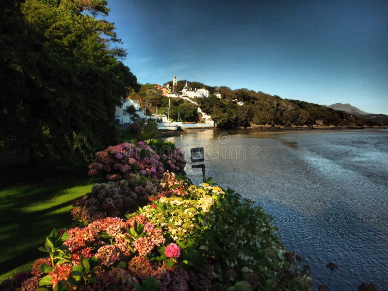 Portmeirion is a tourist village in Gwynedd, North Wales. It was designed and built by Sir Clough Williams-Ellis between 1925 and 1975 in the style of an Italian village, and is now owned by a charitable trust.
The village is located in the community of Penrhyndeudraeth, on the estuary of the River Dwyryd, 2 miles south east of Porthmadog, and 1 mile from Minffordd railway station.Portmeirion has served as the location for numerous films and television shows, and was `The Village` in the 1960s television show The Prisoner. Portmeirion is a tourist village in Gwynedd, North Wales. It was designed and built by Sir Clough Williams-Ellis between 1925 and 1975 in the style of an Italian village, and is now owned by a charitable trust.
The village is located in the community of Penrhyndeudraeth, on the estuary of the River Dwyryd, 2 miles south east of Porthmadog, and 1 mile from Minffordd railway station.Portmeirion has served as the location for numerous films and television shows, and was `The Village` in the 1960s television show The Prisoner.