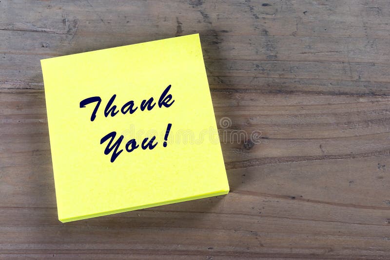 Written thank you text on yellow sticky note. Administrative professionals or secretaries day concept. Written thank you text on yellow sticky note. Administrative professionals or secretaries day concept