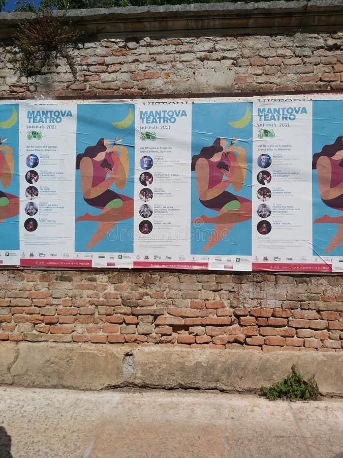 Mantua, 19 July 2021: wall posters advertising a summer theater review from 10 July to 5 August. Mantua, 19 July 2021: wall posters advertising a summer theater review from 10 July to 5 August.
