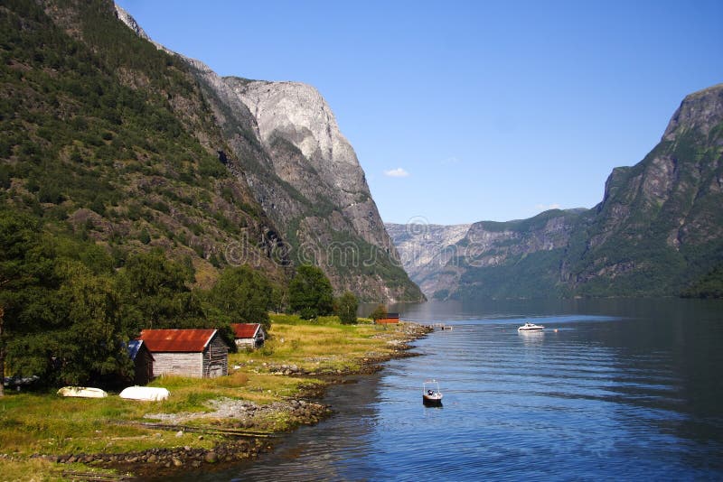 Boat and fishing cabins, naeroeyfjorden, sognefjorden, Norway. Unesco world heritage. Boat and fishing cabins, naeroeyfjorden, sognefjorden, Norway. Unesco world heritage