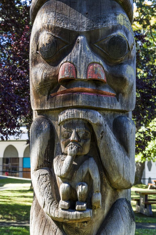 VICTORIA,BC CANADA SEPTEMBER 1,2013: Totem poles in Thunderbird park carved by indigenous Canadians. The park is part of the Royal BC Museums. VICTORIA,BC CANADA SEPTEMBER 1,2013: Totem poles in Thunderbird park carved by indigenous Canadians. The park is part of the Royal BC Museums.