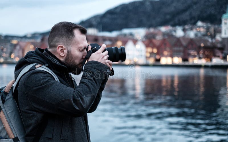 Man tourist against Tyskebryggen in Bergen, Norway. Man tourist against Tyskebryggen in Bergen, Norway.