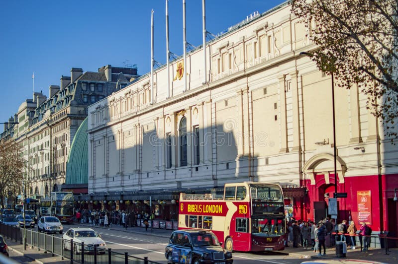 London, England - November 18, 2018: Tourists and other people outside Madame Tussauds museum. The traffic, buses and other vehicles are also visible in london. - Image. London, England - November 18, 2018: Tourists and other people outside Madame Tussauds museum. The traffic, buses and other vehicles are also visible in london. - Image