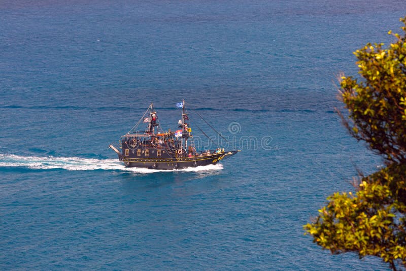 Tourist ship designed like pirate ship, sailing in sea waters near Corfu, Greece. Tourist ship designed like pirate ship, sailing in sea waters near Corfu, Greece