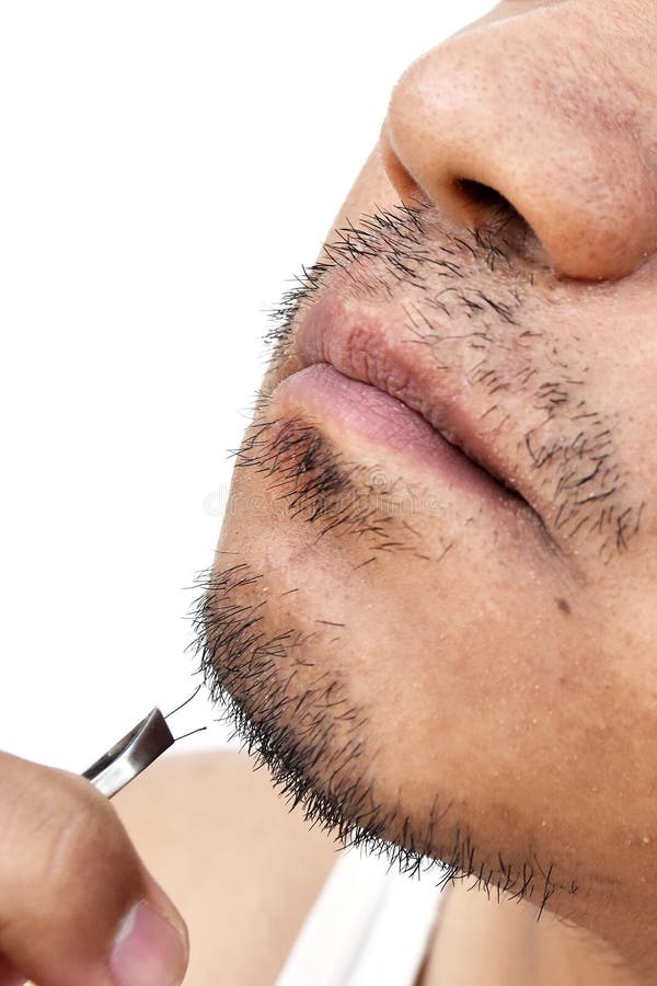 Τράβηγμα ατόμων mustache από τα τσιμπιδάκια στο άσπρο υπόβαθρο στοκ φωτογραφίες Τράβηγμα ατόμων mustache από τα τσιμπιδάκια στο άσπρο υπόβαθρο στοκ φωτογραφίες