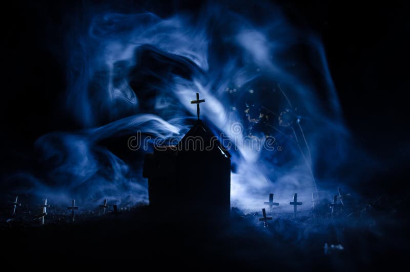 Scary view of zombies at cemetery dead tree, moon, church and spooky cloudy sky with fog, Horror Halloween concept. Toned. Scary view of zombies at cemetery dead tree, moon, church and spooky cloudy sky with fog, Horror Halloween concept. Toned