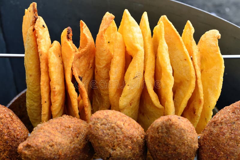 Traditional plain snacks, fried on deep oil, for buying in streets in of Dominican Republic. Traditional plain snacks, fried on deep oil, for buying in streets in of Dominican Republic