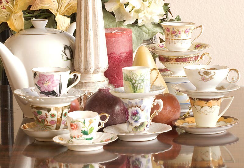 Vintage tea cups, tea pot, candles and flowers, just add finger sandwiches or chocolate truffles for an afternoon tea party or just use as a magnificent center piece,. Vintage tea cups, tea pot, candles and flowers, just add finger sandwiches or chocolate truffles for an afternoon tea party or just use as a magnificent center piece,