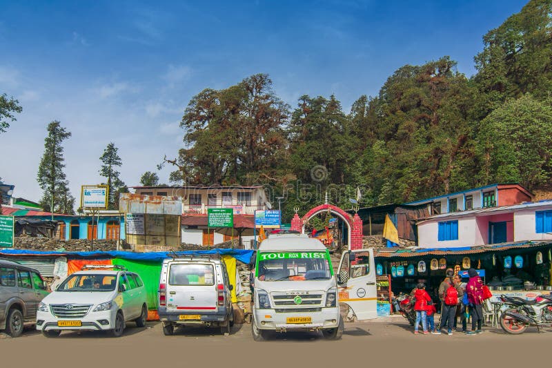 Chopta, Uttarakhand, India - 1st November 2018 : Tourist cars and buses for trekkers of Tungnath trek route, one of the highest Shiva temples in the world, the highest of the five Panch Kedar temples. Chopta, Uttarakhand, India - 1st November 2018 : Tourist cars and buses for trekkers of Tungnath trek route, one of the highest Shiva temples in the world, the highest of the five Panch Kedar temples