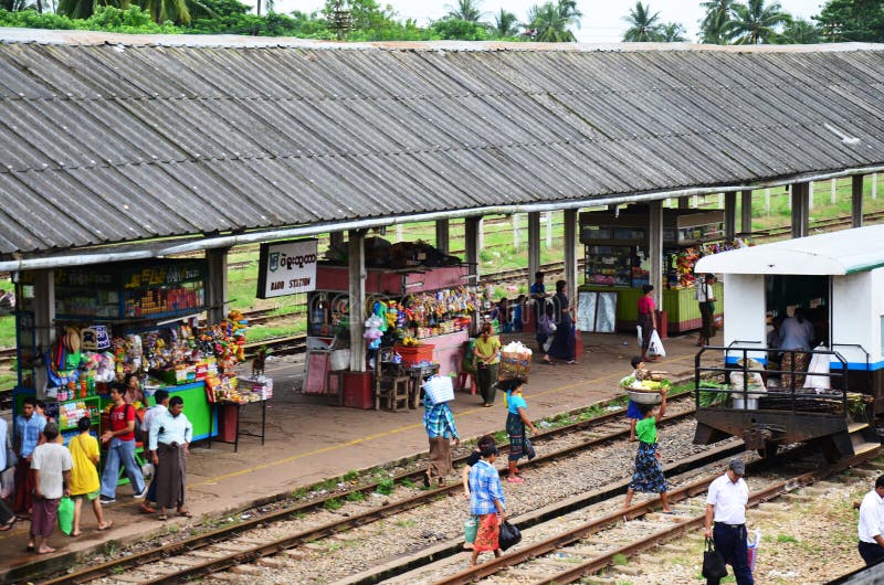 Burmese people waiting train and selling product at railway station in Bago, Myanmar. Bago formerly Pegu, is a city and the capital of Bago Region in Myanmar (Burma). It is located 50 miles (80 km) north-east of Yangon. Bago (formerly Pegu) is the capital city of Bago Division in the Irrawaddy region of Myanmar. On the main road between North and South Myanmar, this is a highly noisy and trafficked town. From Yangon, leave in the morning by taxi (US$40-50), or by bus (from the corner of Strand and Sule Pagoda Road and also from the Aung Mingalar Bus Terminal), or by train (US$4 upper class, US$1 for ordinary seat, all Mandalay and Mawlamyine bound trains stop there). A taxi is the best because youll need one to see the sights in Bago (which are quite far apart) and you can stop at Taukkyan on the way. Burmese people waiting train and selling product at railway station in Bago, Myanmar. Bago formerly Pegu, is a city and the capital of Bago Region in Myanmar (Burma). It is located 50 miles (80 km) north-east of Yangon. Bago (formerly Pegu) is the capital city of Bago Division in the Irrawaddy region of Myanmar. On the main road between North and South Myanmar, this is a highly noisy and trafficked town. From Yangon, leave in the morning by taxi (US$40-50), or by bus (from the corner of Strand and Sule Pagoda Road and also from the Aung Mingalar Bus Terminal), or by train (US$4 upper class, US$1 for ordinary seat, all Mandalay and Mawlamyine bound trains stop there). A taxi is the best because youll need one to see the sights in Bago (which are quite far apart) and you can stop at Taukkyan on the way.