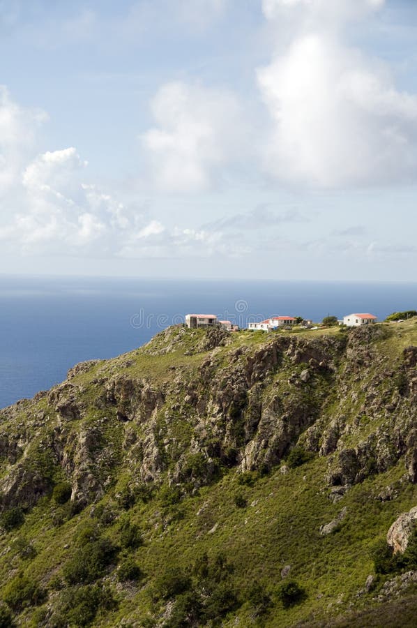 Typical houses on cliff mountain over Caribbean Sea Saba Dutch Netherlands Antilles. Typical houses on cliff mountain over Caribbean Sea Saba Dutch Netherlands Antilles