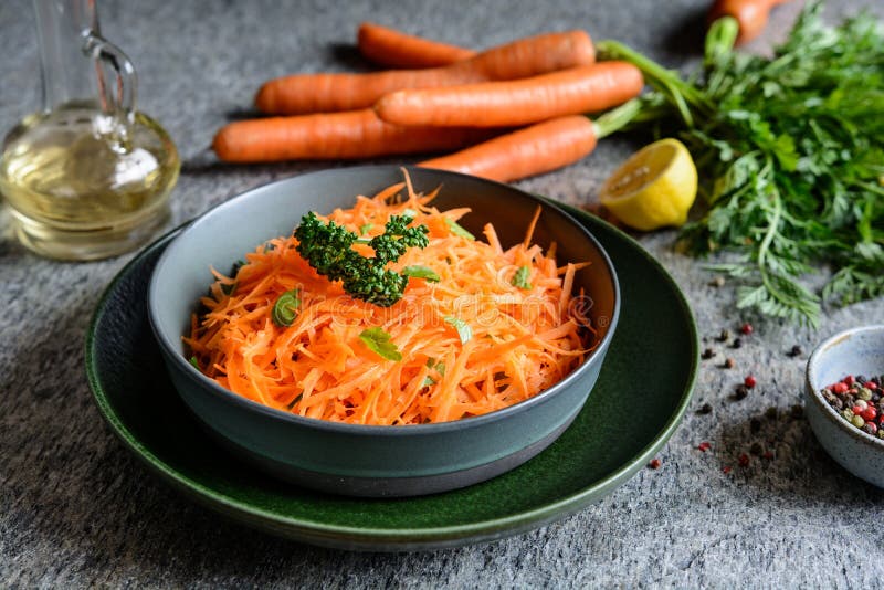 Healthy grated carrot salad with lemon juice and olive oil. Healthy grated carrot salad with lemon juice and olive oil