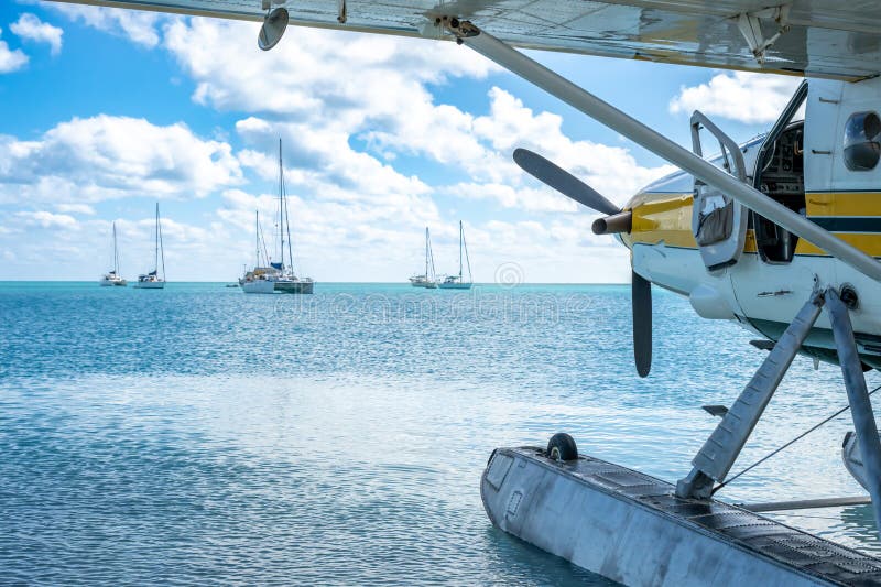 Seaplane floating in the water at Dry Tortugas National Park with distant boats. . High quality photo. Seaplane floating in the water at Dry Tortugas National Park with distant boats. . High quality photo