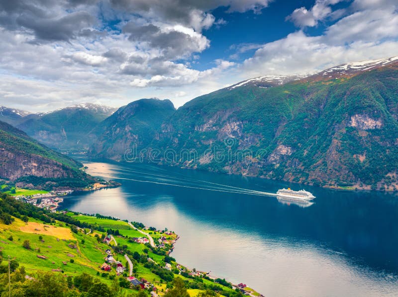 Awesome summer view of Sognefjorden fjord. Colorful morning scene with Aurlandsvangen village, Norway. Traveling concept background. Artistic style post processed photo. Awesome summer view of Sognefjorden fjord. Colorful morning scene with Aurlandsvangen village, Norway. Traveling concept background. Artistic style post processed photo