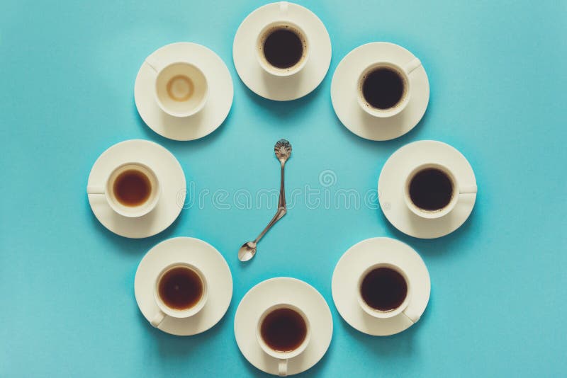 Overhead view of the steps in drinking a cup of fresh espresso. Coffee clock. Art food. Good morning concept. Toned. Overhead view of the steps in drinking a cup of fresh espresso. Coffee clock. Art food. Good morning concept. Toned.