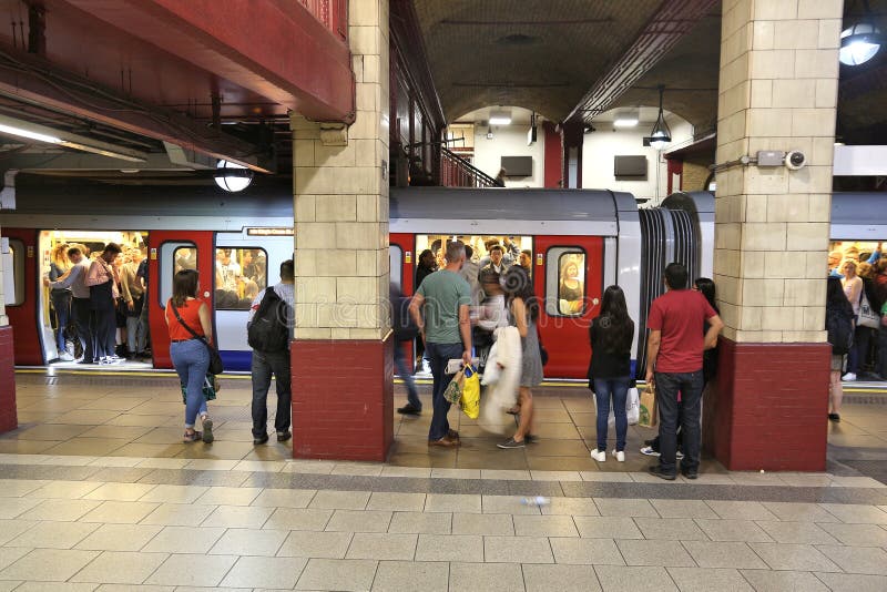 LONDON, UK - JULY 7, 2016: People wait at Baker Street underground station in London. London Underground is the 11th busiest metro system worldwide with 1.1 billion annual rides. LONDON, UK - JULY 7, 2016: People wait at Baker Street underground station in London. London Underground is the 11th busiest metro system worldwide with 1.1 billion annual rides.