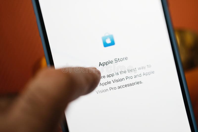 California, USA - Jan 21, 2024: A tilt-shift lens captures a male hand typing on the Apple Store icon displayed on the iPhone 15 Pro, to pre-order the latest Apple Vision Pro virtual reality headset. California, USA - Jan 21, 2024: A tilt-shift lens captures a male hand typing on the Apple Store icon displayed on the iPhone 15 Pro, to pre-order the latest Apple Vision Pro virtual reality headset