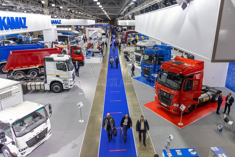 Trucks KAMAZ and buses KAMAZ at the international exhibition of commercial transport Comtrans 2021. A wide shot, a view from above. Moscow, Russia - September 7-11, 2021. Trucks KAMAZ and buses KAMAZ at the international exhibition of commercial transport Comtrans 2021. A wide shot, a view from above. Moscow, Russia - September 7-11, 2021.