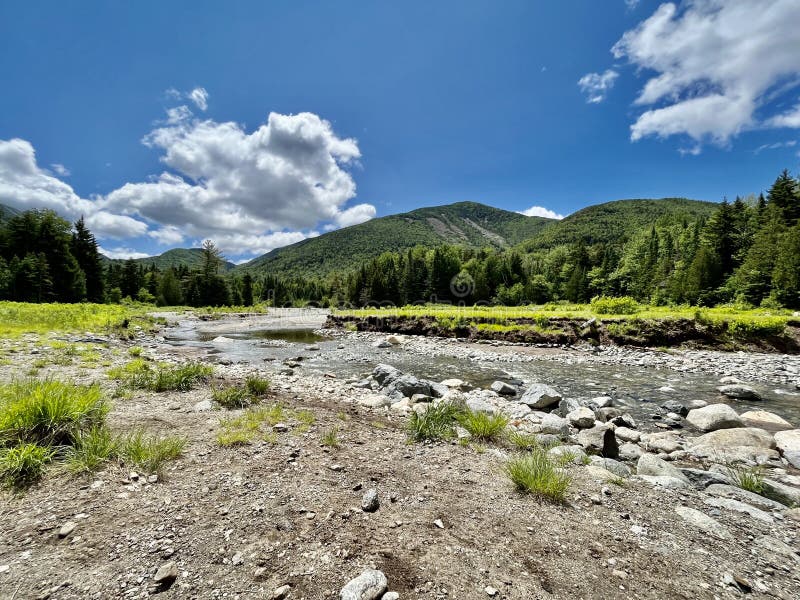 This photo evokes a peaceful wilderness vibe. It looks at Mt. Colden through the clearing at Marcy Dam. This photo evokes a peaceful wilderness vibe. It looks at Mt. Colden through the clearing at Marcy Dam.