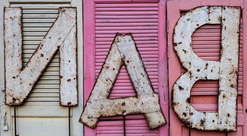 BAN phrase on doors. Old rusty letters BAN nailed to the door. Version 2. BAN phrase on doors. Old rusty letters BAN nailed to the door. Version 2.