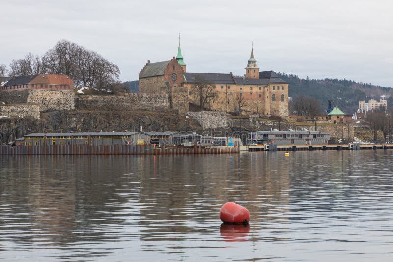 Norway, Oslo -17 February 2019: Akershus Fortress in Oslo, Norway. View from the Aker Brygge Marina. Norway, Oslo -17 February 2019: Akershus Fortress in Oslo, Norway. View from the Aker Brygge Marina