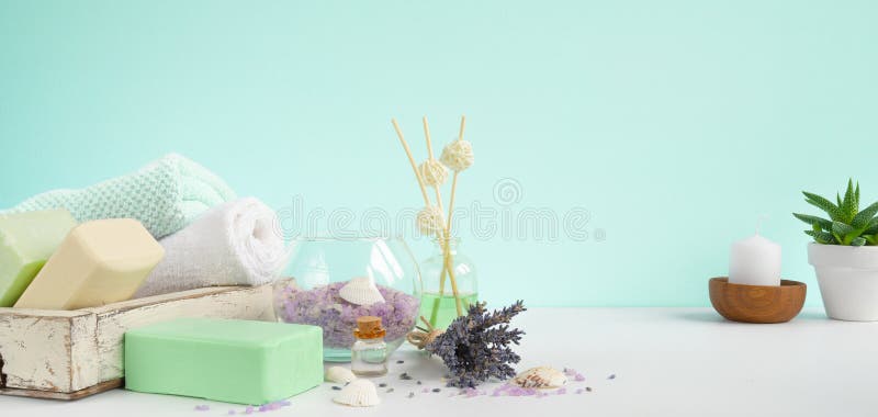 Natural bath Soaps for aromatherapy and body care . Lavender Spa treatment, towels, sea salt and dried herbs. Aromateraphy and spa mint background banner. Natural bath Soaps for aromatherapy and body care . Lavender Spa treatment, towels, sea salt and dried herbs. Aromateraphy and spa mint background banner.