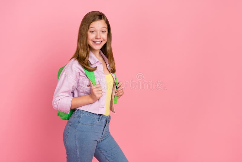 Photo of cheerful positive pretty cute lady prepare 1-september wear backpack jacket isolated pink color background. Photo of cheerful positive pretty cute lady prepare 1-september wear backpack jacket isolated pink color background.