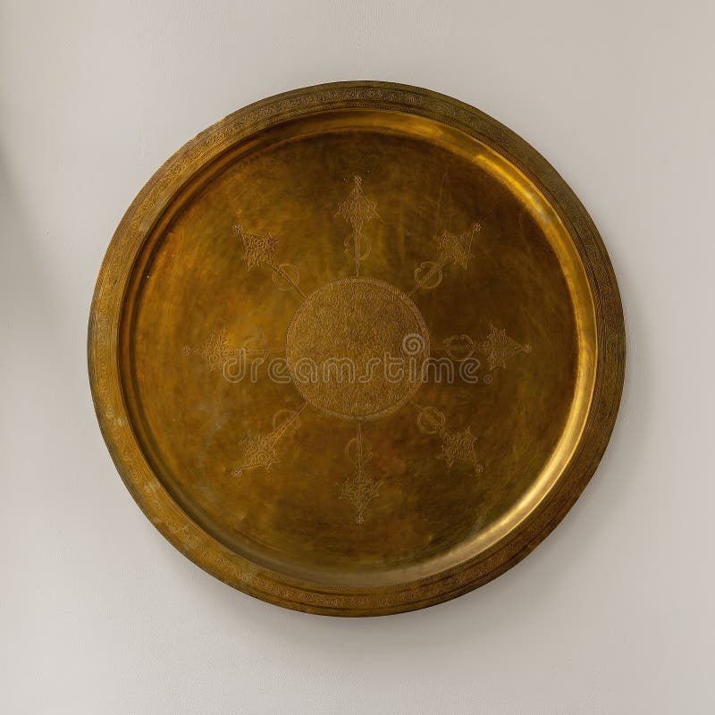 Pictured is a bronze plate with geometric arab design at the Riad Maison Bleue, a luxury boutique hotel in Fes, Morocco. The Riad Maison Bleue was created in a house dating from the 19th century whose former owner, was the late Moulay Bel Arbi El Alaoui, famous judge and professor of theology. Today the luxury boutique hotel it is managed by the El Abbadi`s family. Pictured is a bronze plate with geometric arab design at the Riad Maison Bleue, a luxury boutique hotel in Fes, Morocco. The Riad Maison Bleue was created in a house dating from the 19th century whose former owner, was the late Moulay Bel Arbi El Alaoui, famous judge and professor of theology. Today the luxury boutique hotel it is managed by the El Abbadi`s family.