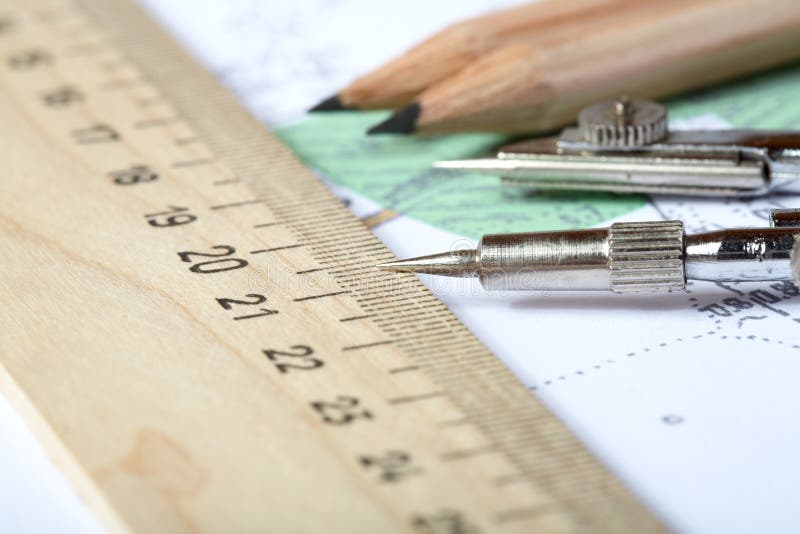 Topographic map of district with measuring instrument, ruler and a pencil. Topographic map of district with measuring instrument, ruler and a pencil