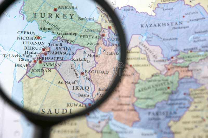 Syria and Iraq on a map, seen through a magnifying glass. Syria and Iraq on a map, seen through a magnifying glass