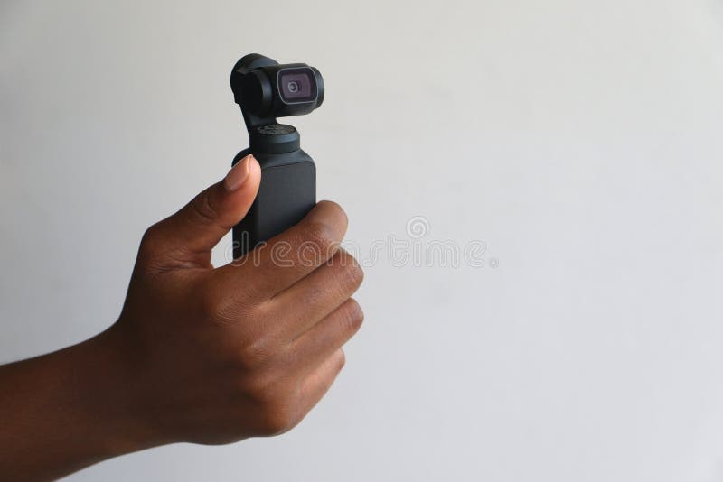 Χέρι - κρατημένη κάμερα τσεπών dji osmo στοκ φωτογραφία με δικαίωμα ελεύθερης χρήσης Χέρι - κρατημένη κάμερα τσεπών dji osmo στοκ φωτογραφία με δικαίωμα ελεύθερης χρήσης