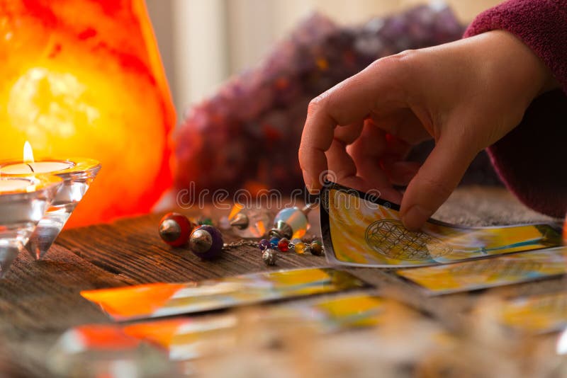 Fortune teller holding tarot card. Fortune teller holding tarot card