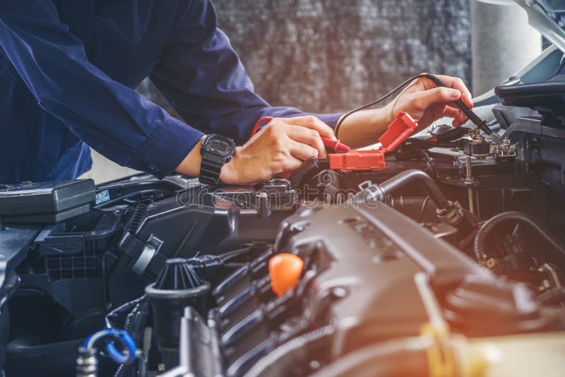 Hands of car mechanic working in auto repair service. Hands of car mechanic working in auto repair service