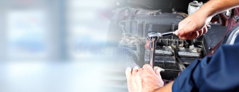 Hands of car mechanic with wrench in auto repair service. Hands of car mechanic with wrench in auto repair service.