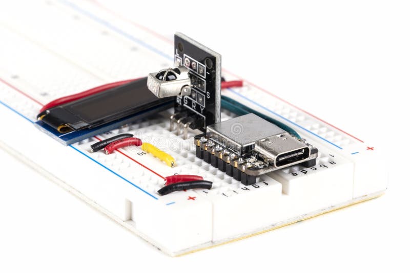 Homemade Simple Computer Components on a Electronic Breadboard Isolated on White Background #2. Homemade Simple Computer Components on a Electronic Breadboard Isolated on White Background #2