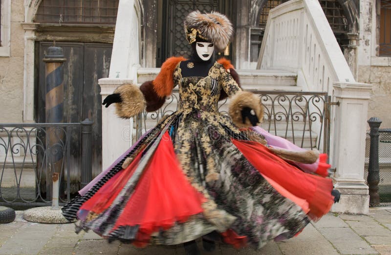 Beautiful woman dancing at the carnival in Venice, dress in motion blur. Beautiful woman dancing at the carnival in Venice, dress in motion blur