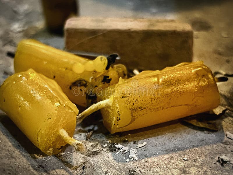 Used yellow candle, put on tray,ashes of Incense sticks plenty around,equipment for praying. Used yellow candle, put on tray,ashes of Incense sticks plenty around,equipment for praying