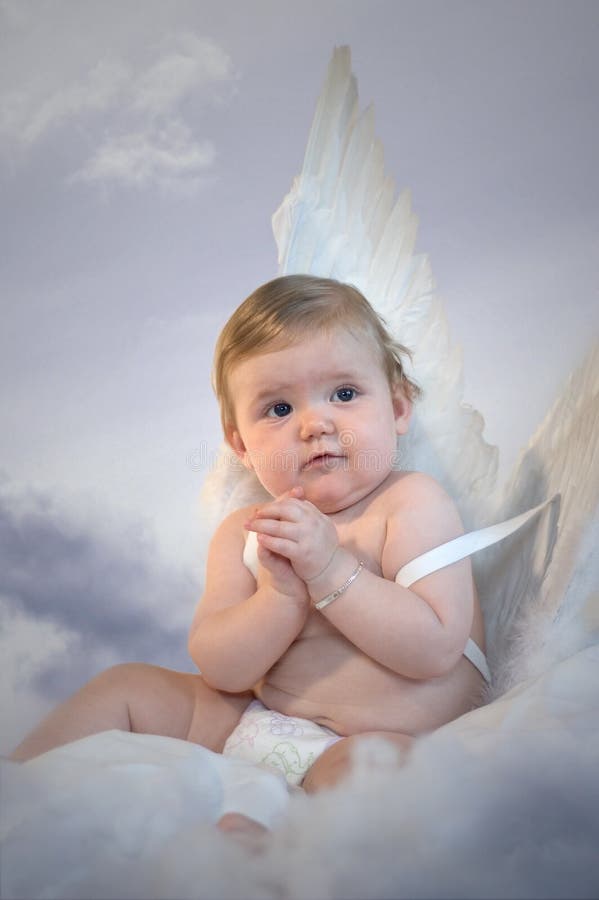 Cute Baby with angel wings sitting in clouds and hands held praying. Cute Baby with angel wings sitting in clouds and hands held praying