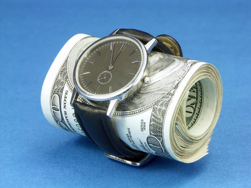 Wrist watch wrapped around a roll of 100 us dollar banknotes over blue background. Wrist watch wrapped around a roll of 100 us dollar banknotes over blue background