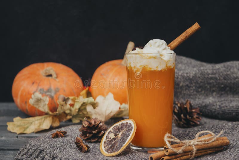 1 Cup pumpkin juice with whipped cream and cinnamon, fresh whole pumpkins, a slice of dried orange, cones, dry fallen leaves, vegetable juice. 1 Cup pumpkin juice with whipped cream and cinnamon, fresh whole pumpkins, a slice of dried orange, cones, dry fallen leaves, vegetable juice