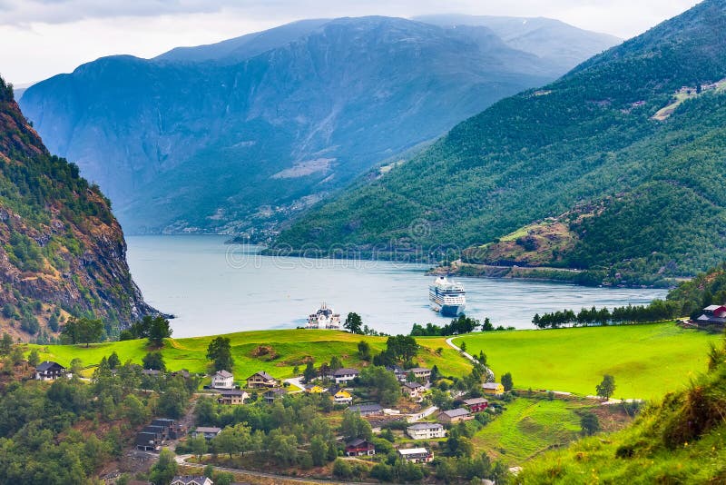 Flam, Norway, norwegian fjord village with Sognefjord landscape and cruise ship. Flam, Norway, norwegian fjord village with Sognefjord landscape and cruise ship