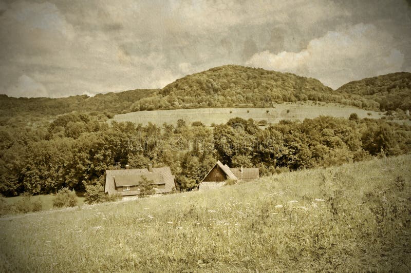 Country idyll with old farmhouse and hill. Country idyll with old farmhouse and hill