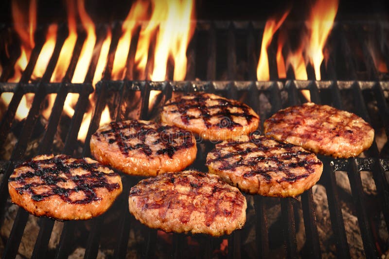 BBQ Grilled Burgers Patties On The Hot Flaming Charcoal Grill, Top View. Cookout Food, Good Snack For Outdoor Party Or Picnic. BBQ Grilled Burgers Patties On The Hot Flaming Charcoal Grill, Top View. Cookout Food, Good Snack For Outdoor Party Or Picnic