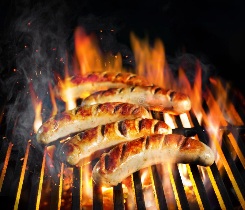 Grilled sausage on the flaming grill with smoke. Grilled sausage on the flaming grill with smoke