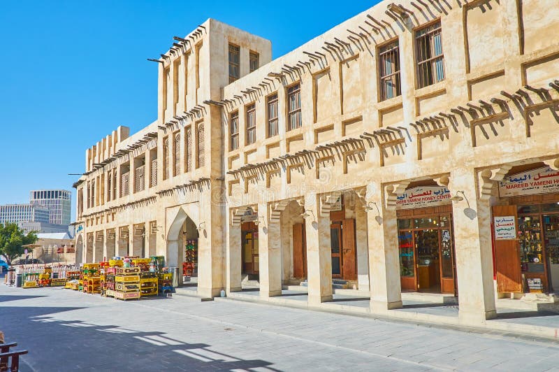 DOHA, QATAR - FEBRUARY 13, 2018: The pleasant shopping in Souq Waqif - historical location with restored authentic quarters, numerous stores and stalls of interesting local goods, on February 13 in Doha. DOHA, QATAR - FEBRUARY 13, 2018: The pleasant shopping in Souq Waqif - historical location with restored authentic quarters, numerous stores and stalls of interesting local goods, on February 13 in Doha.