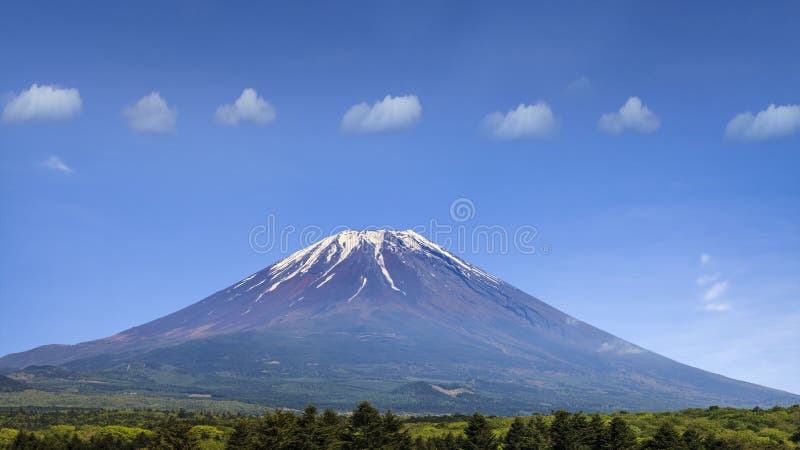 The nice mountain with align clouds with nice blue and green tree. The nice mountain with align clouds with nice blue and green tree