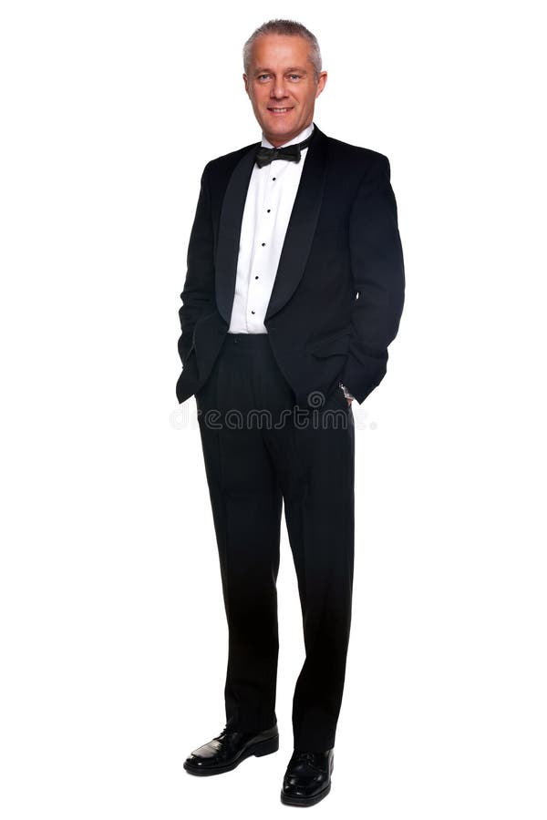 A mature male wearing a black tuxedo and bow tie, isolated on a white background. A mature male wearing a black tuxedo and bow tie, isolated on a white background.