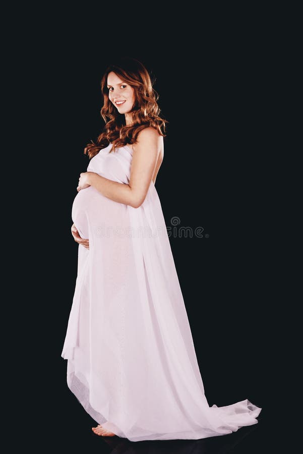 Beautiful pregnant woman wrapping at chiffon. Beautiful pregnant woman wrapping at chiffon.