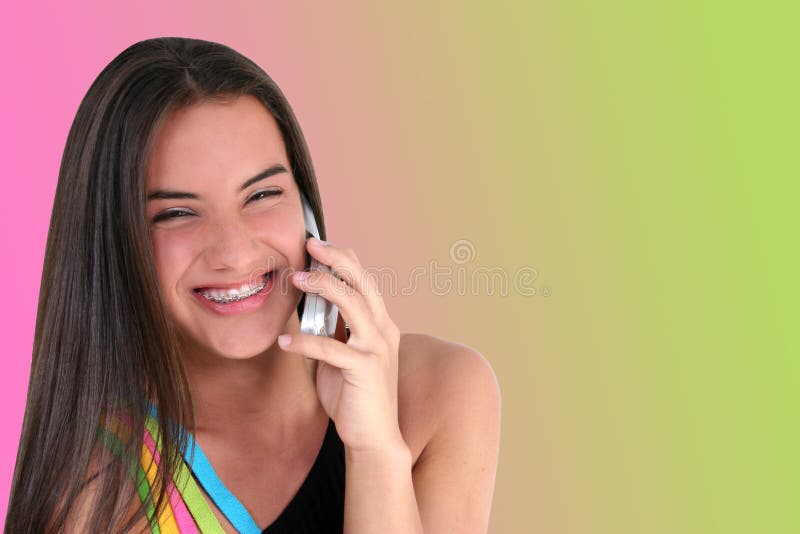 Beautiful teen girl smiling/talking on cellphone. Shot with the Canon 20D. Beautiful teen girl smiling/talking on cellphone. Shot with the Canon 20D.