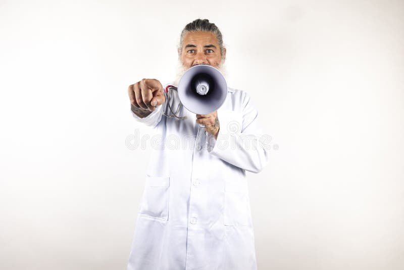 Handsome modern doctor with megaphone over isolated white background pointing with finger . Handsome modern doctor with megaphone over isolated white background pointing with finger .